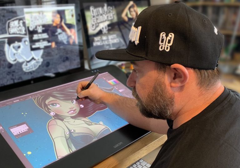 Colin ‘Choodie’ Hood in his Newquay studio, surrounded by Growl & Grandeur apparel, embodying the brand's creative and rebellious spirit.