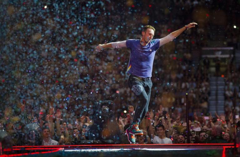 Coldplay performing live on stage during their Music Of The Spheres tour at Zayed Sports City Stadium in Abu Dhabi, January 2025.