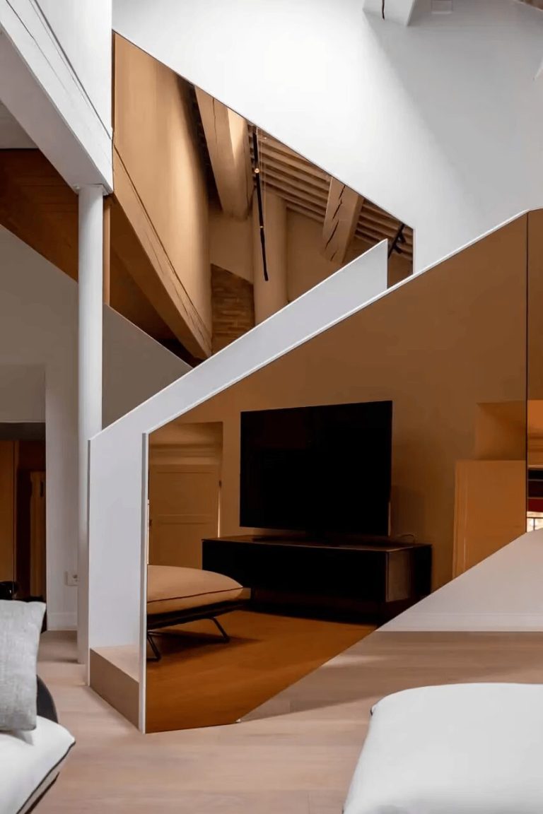 tissellistudioarchitetti Renovates Penthouse with Golden Staircase