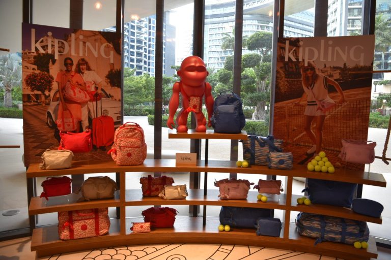 Attendees exploring Kipling's SS24 collection at the brand event in Dubai