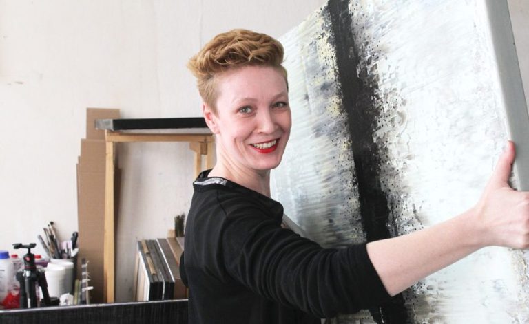 Lali Torma creating a vibrant abstract painting, showcasing her unique artistic style and intuitive approach.