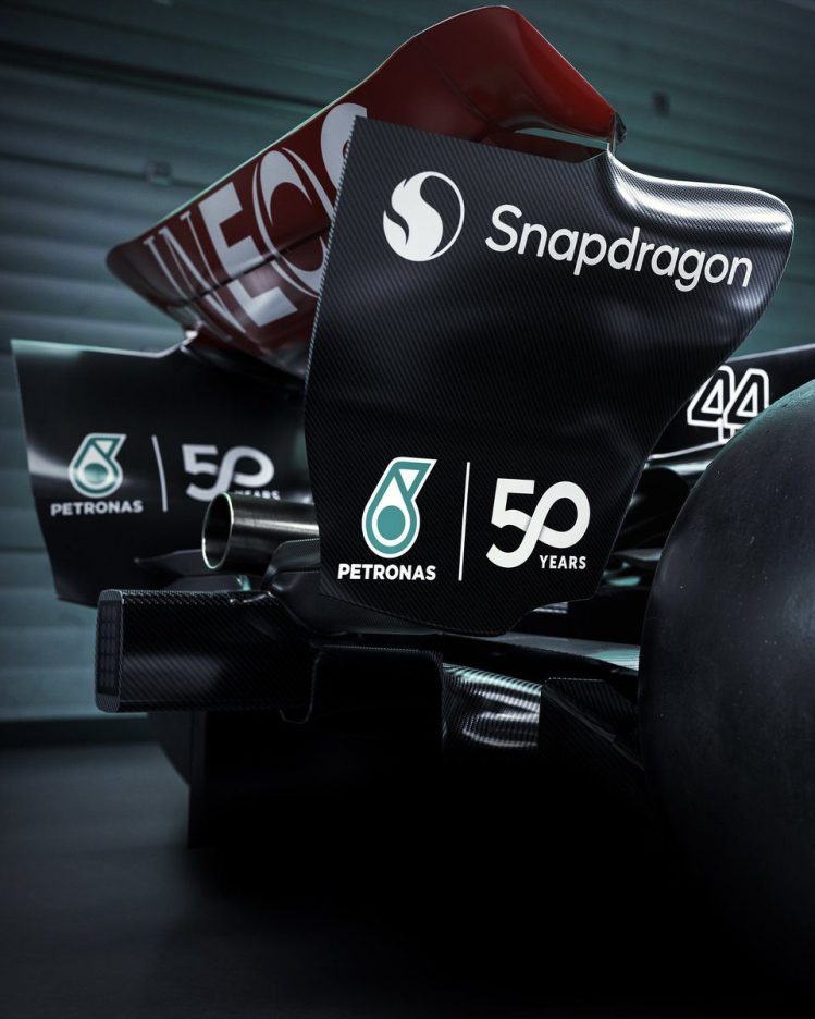 Mercedes W15 car featuring a special green PETRONAS 50th anniversary livery for the Singapore Grand Prix.