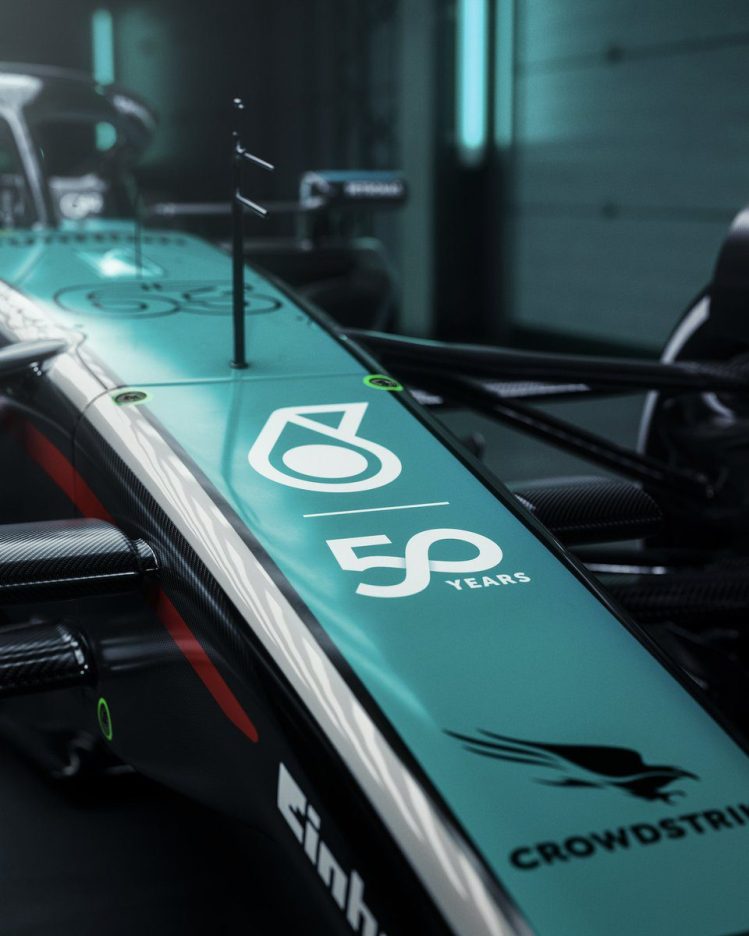 Mercedes W15 car featuring a special green PETRONAS 50th anniversary livery for the Singapore Grand Prix.