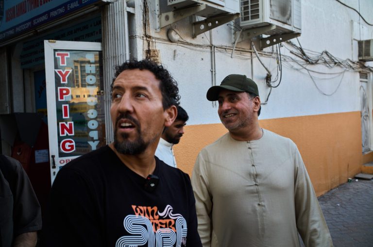 Karim Jabbari creating live light calligraphy during the 'Lost Tradition' performance at Inloco Gallery.